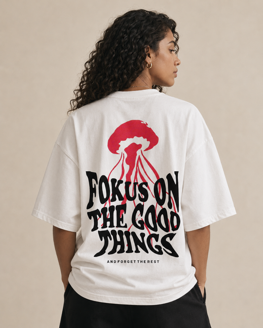Back view of a white T-shirt featuring a red target and the text ‘FOCUS ON THE GOOD THINGS’ with ‘and forget the rest’ beneath.
